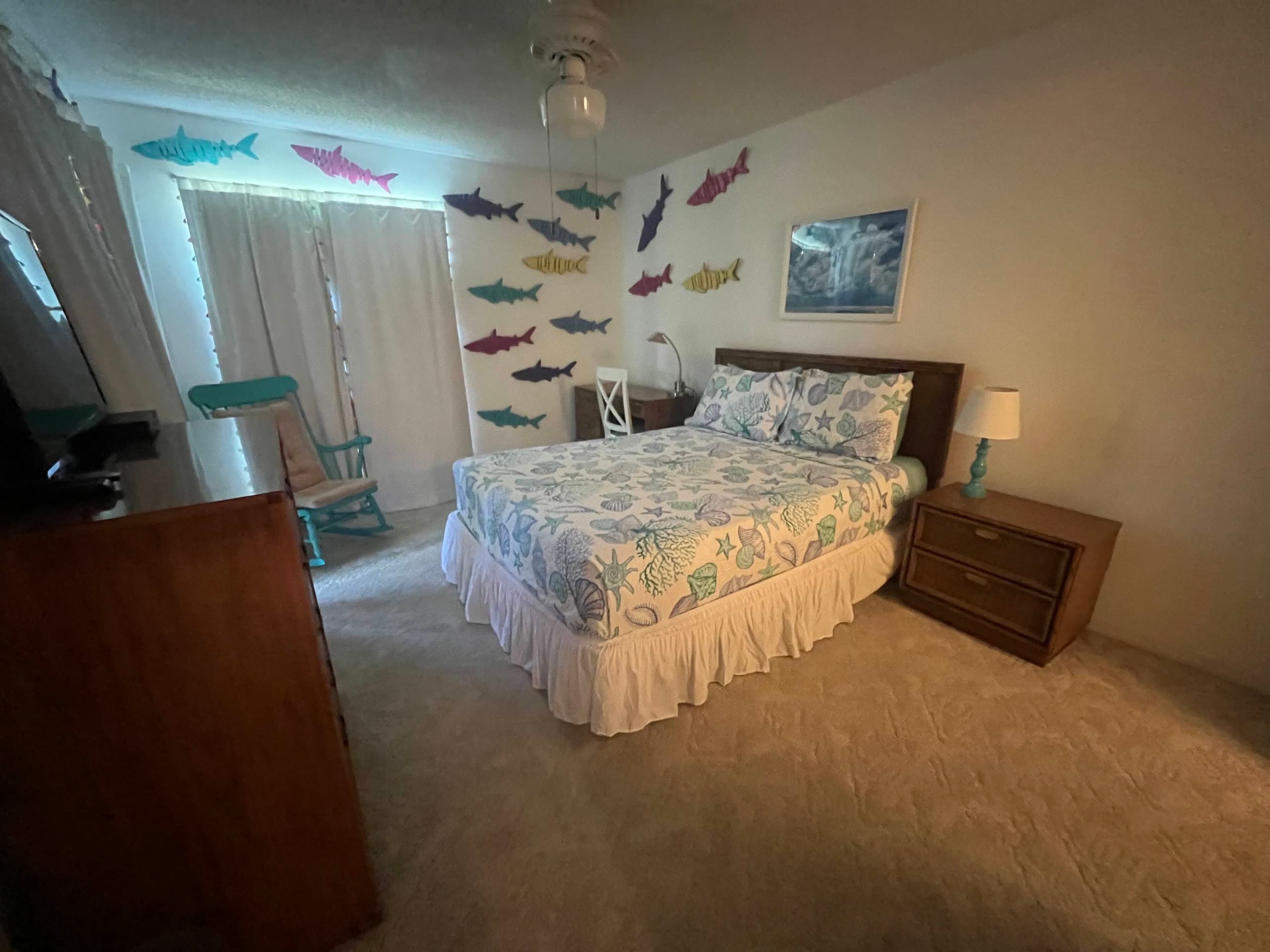 Guest bedroom with a freshly made bed and coastal decor